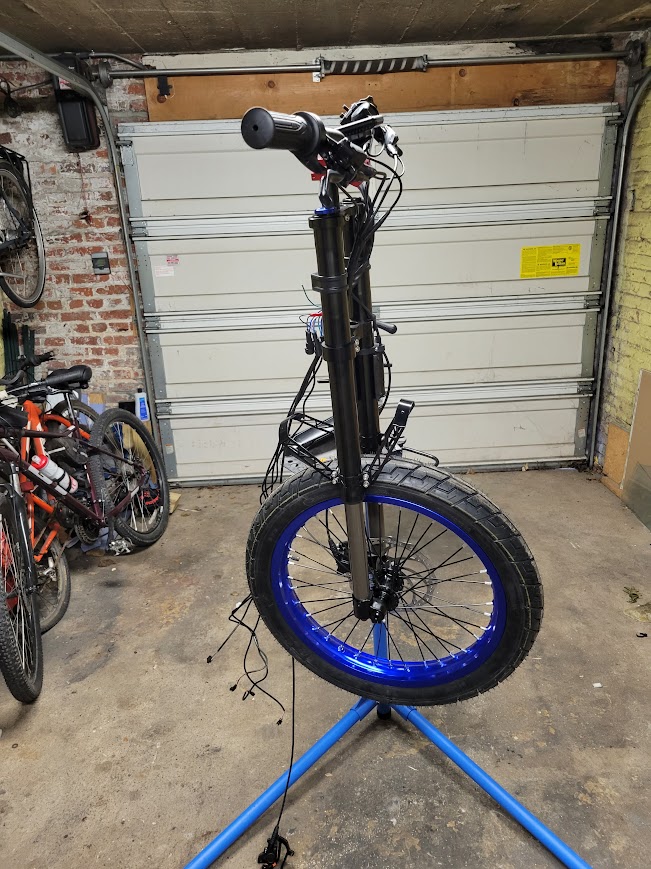 The front fork and wheel being assembled on a bike stand
